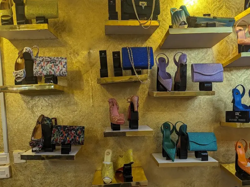 Party heels with matching clutch bags and men's loafers on display at a Tejuosho shoe shop